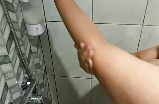 Beautiful girl in the shower looks very beautiful with a beautiful body