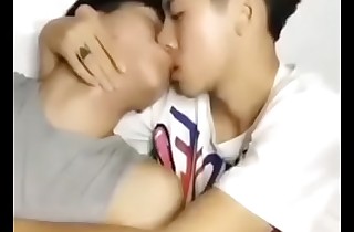 Cute Indian men kissing each other
