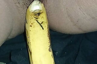 Indian girl playing with banana