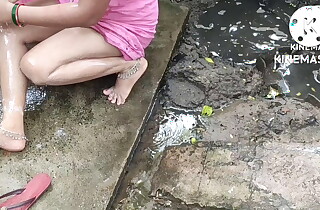 Indian house wife rinse outside