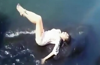 Drenched Hot Indian Actress getting Drenched in sexy clothes in river