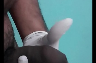 Indian man cums using latex glove
