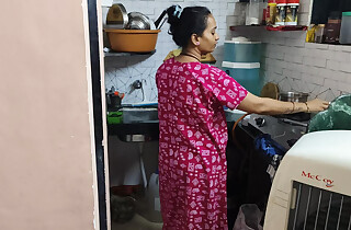 The owner be created tha saree in tha kitchen to tha maid
